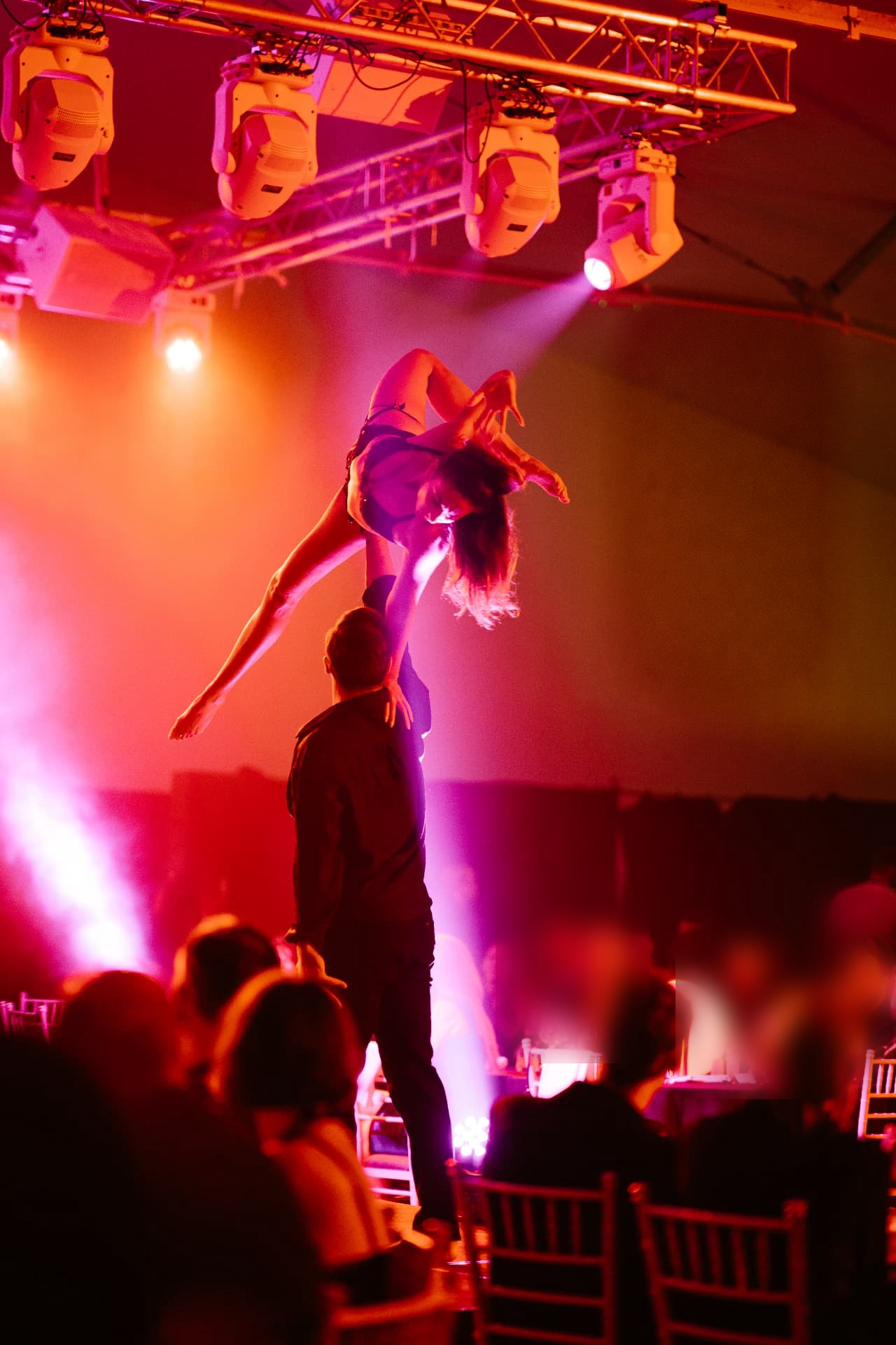 Acrobatic performers entertaining guests at a gala dinner